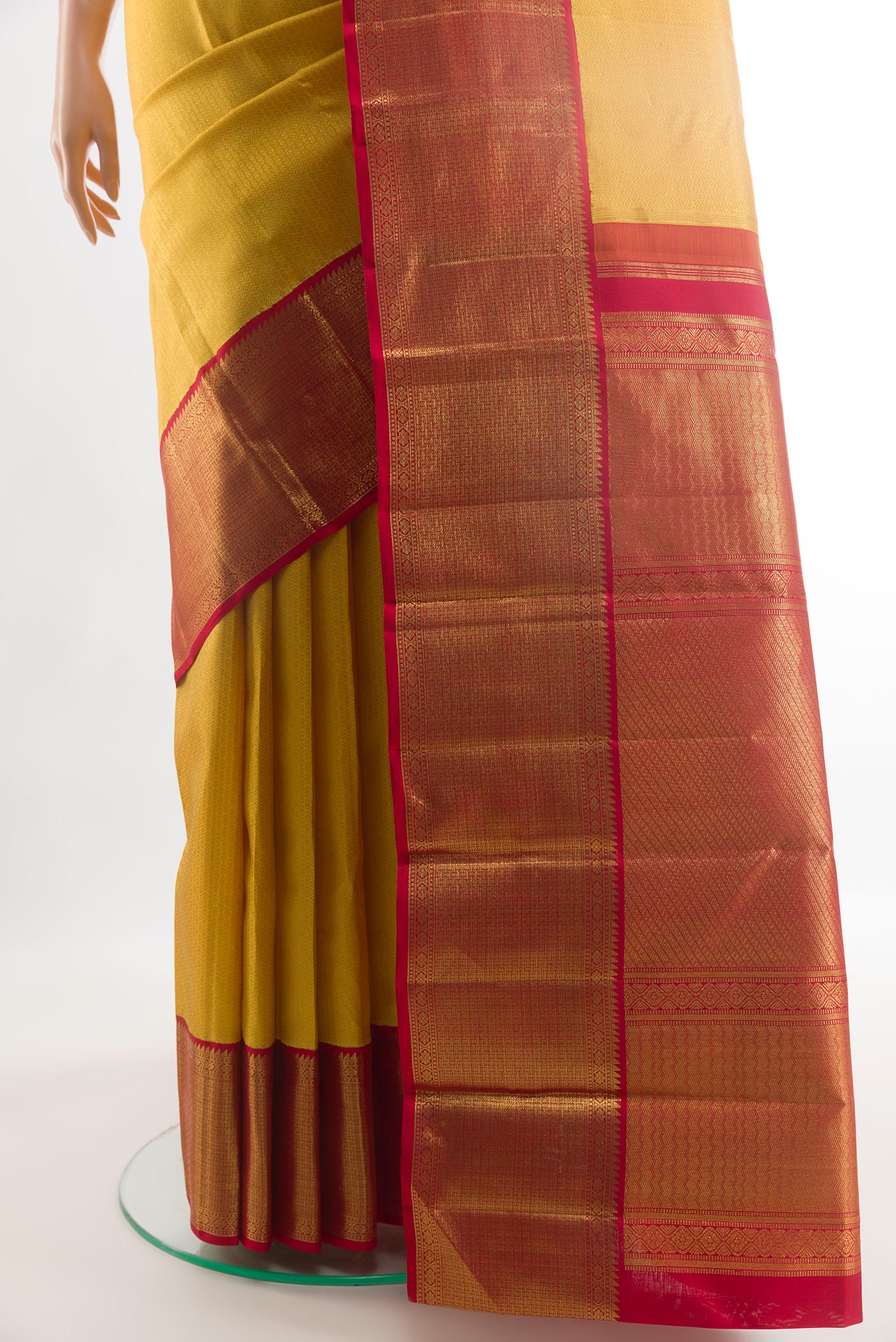 Pleats and pallu of Yellow Kanjivaram Silk Saree with Zari Brocade on the body and Zari Border. 