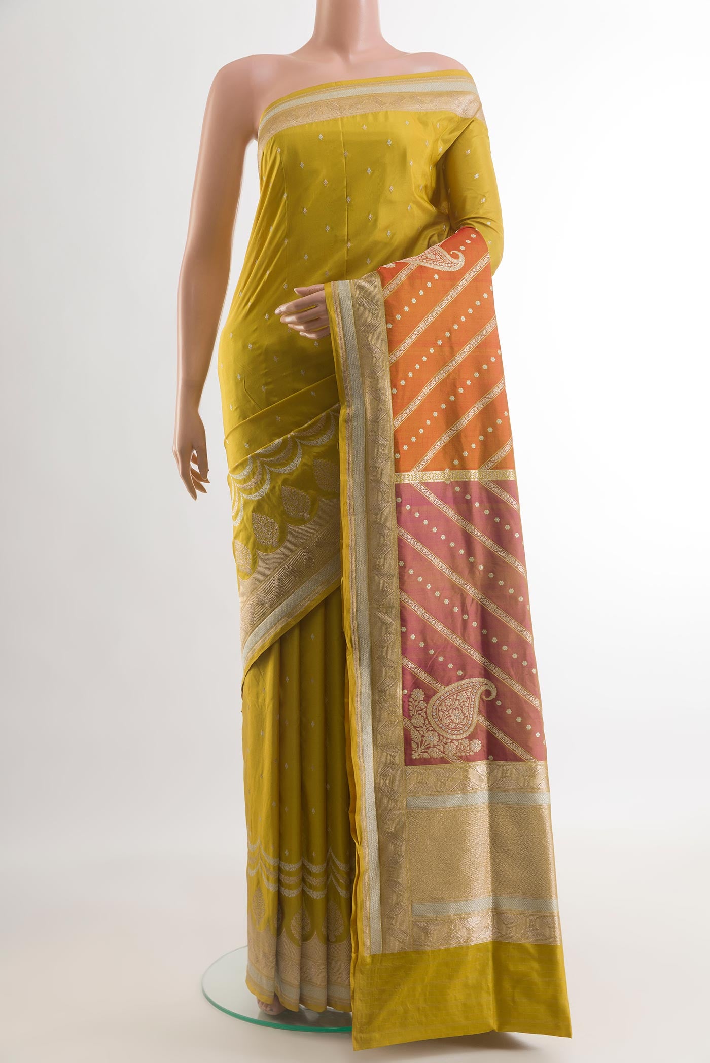 Mehandi Green Banarasi Silk Saree with Zari Butta on the body and Zari Border.  displayed on a mannequin