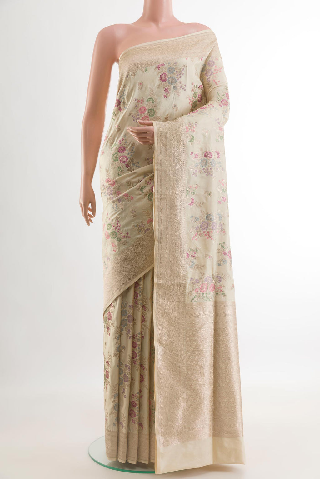Cream Banarasi Silk Saree with Zari Brocade on the body and Zari Border.  displayed on a mannequin