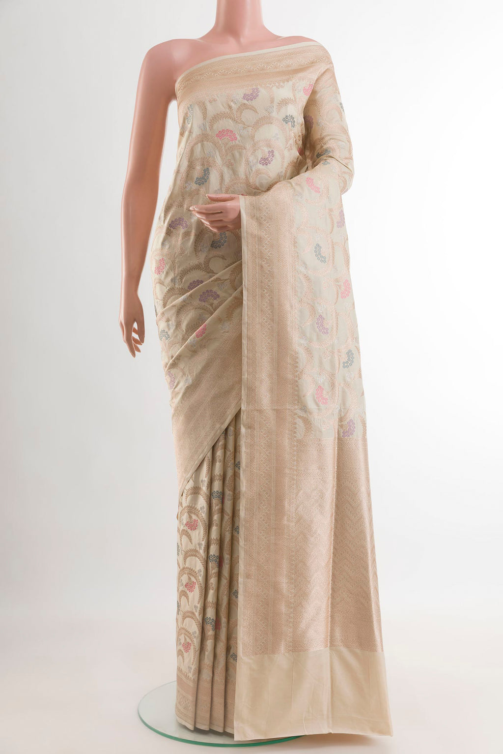 Cream Banarasi Silk Saree with Zari Brocade on the body and Zari Border.  displayed on a mannequin