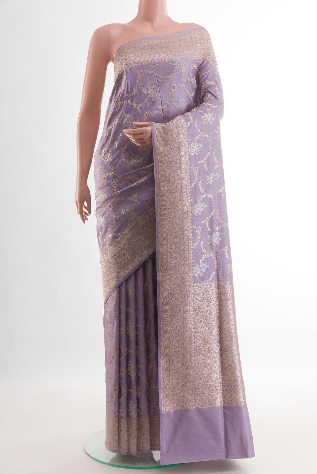 Lilac Banarasi Silk Saree with Zari Brocade on the body and Zari Border.  displayed on a mannequin