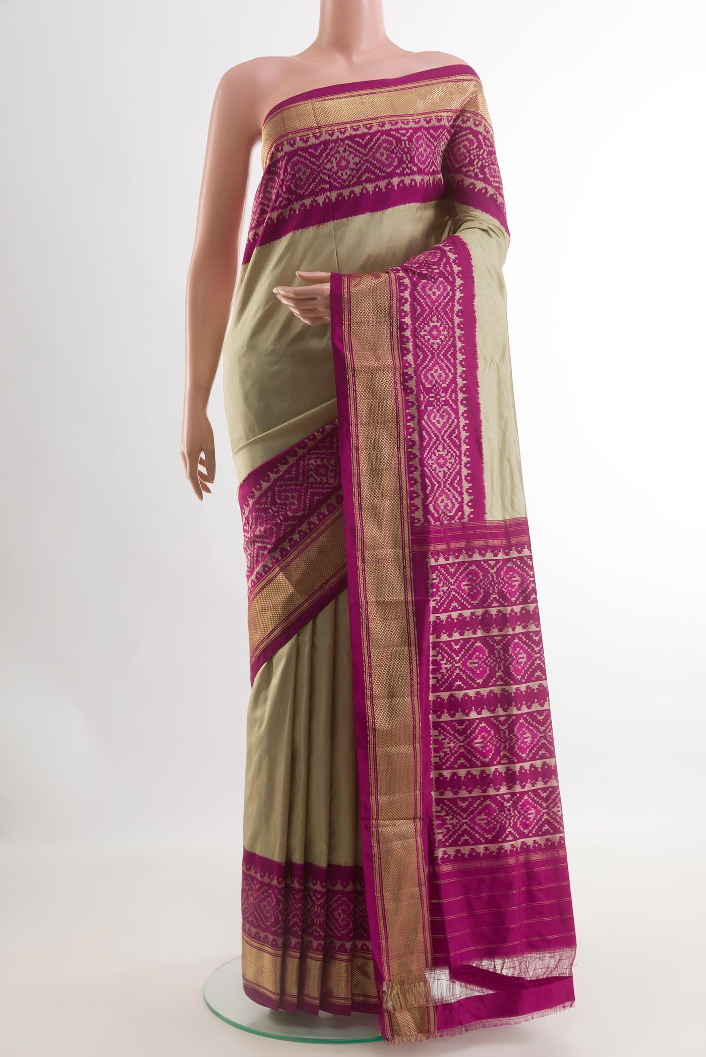 Beige Pochampally Silk Saree with Plain Body and Ikat Border.  displayed on a mannequin