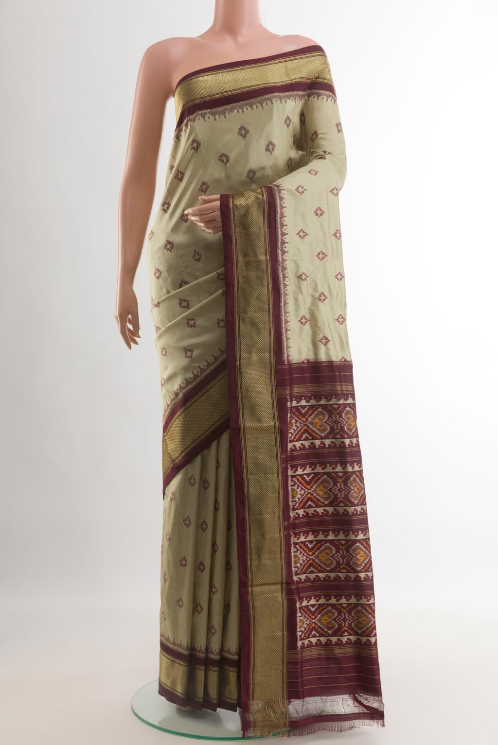 Cream Pochampally Silk Saree with Pure Ikat on the body and Zari Border.  displayed on a mannequin