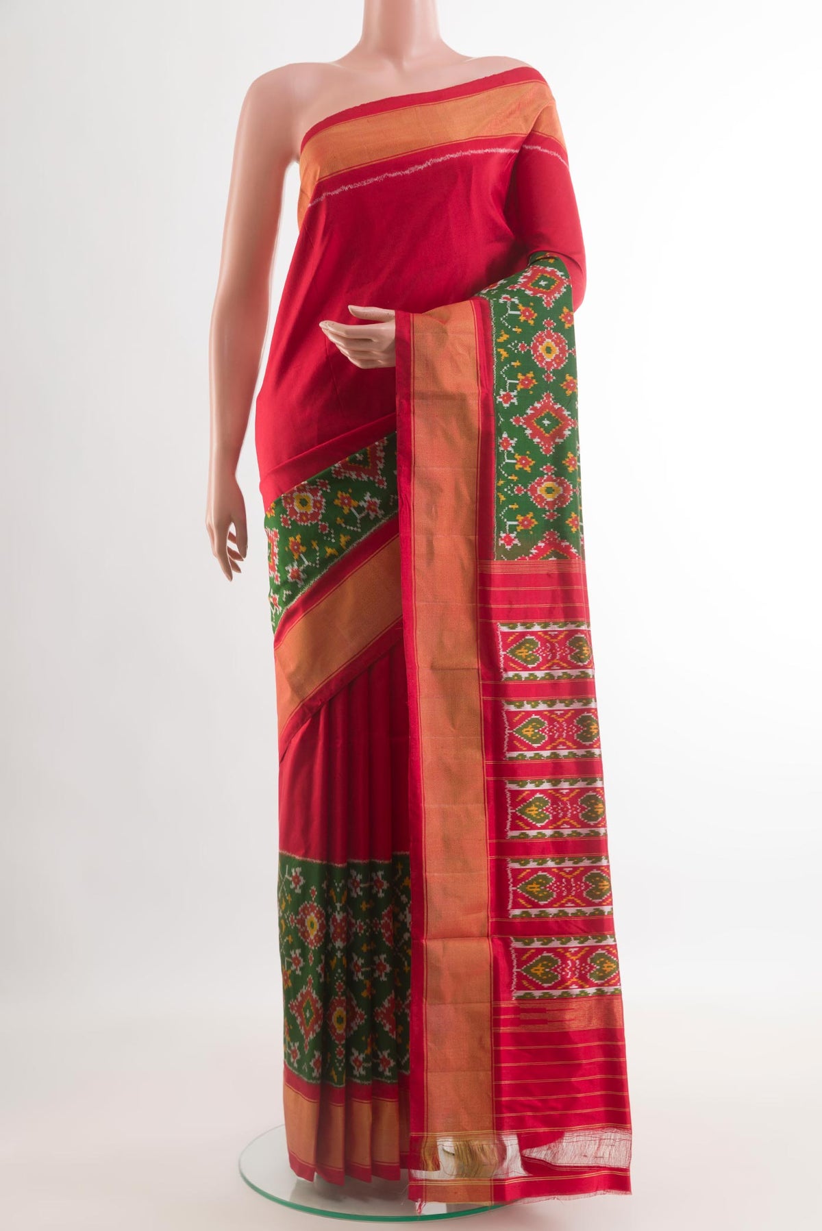 Green Pochampally Silk Saree with Pure Ikat on the body and Zari Border.  displayed on a mannequin