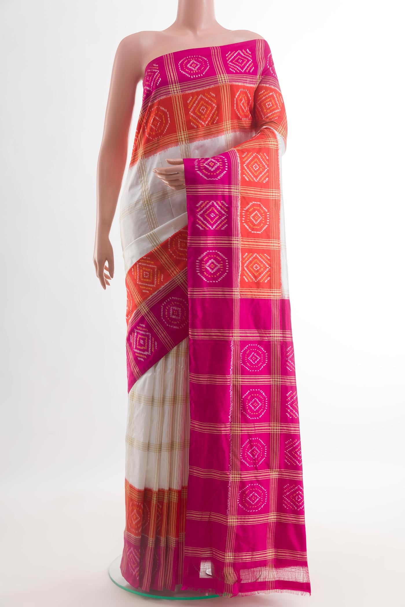 Off White Pochampally Silk Saree with Checked design on the body and Zari Border.  displayed on a mannequin