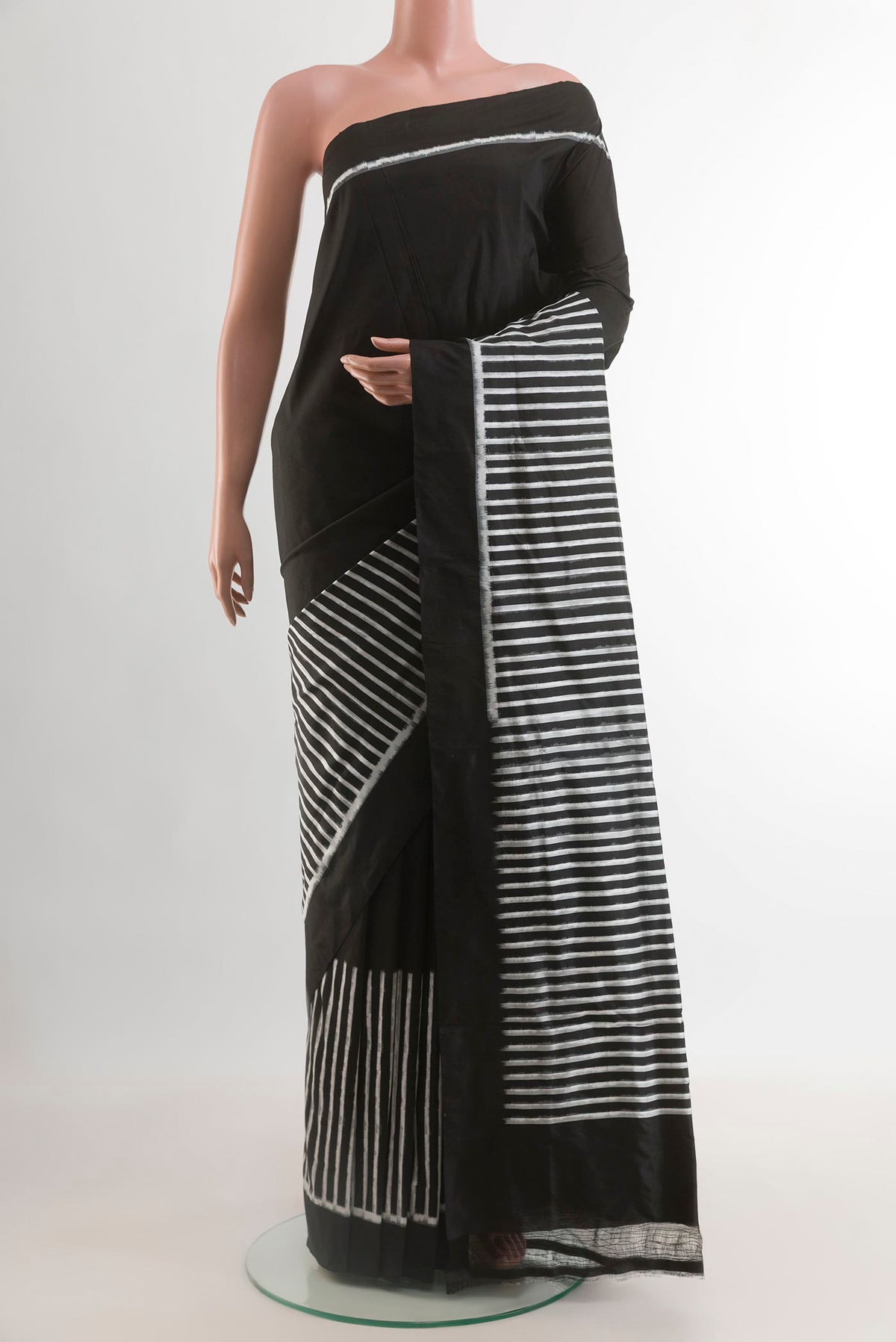 Black Pochampally Silk Saree with Stripes on the body and Plain Border.  displayed on a mannequin