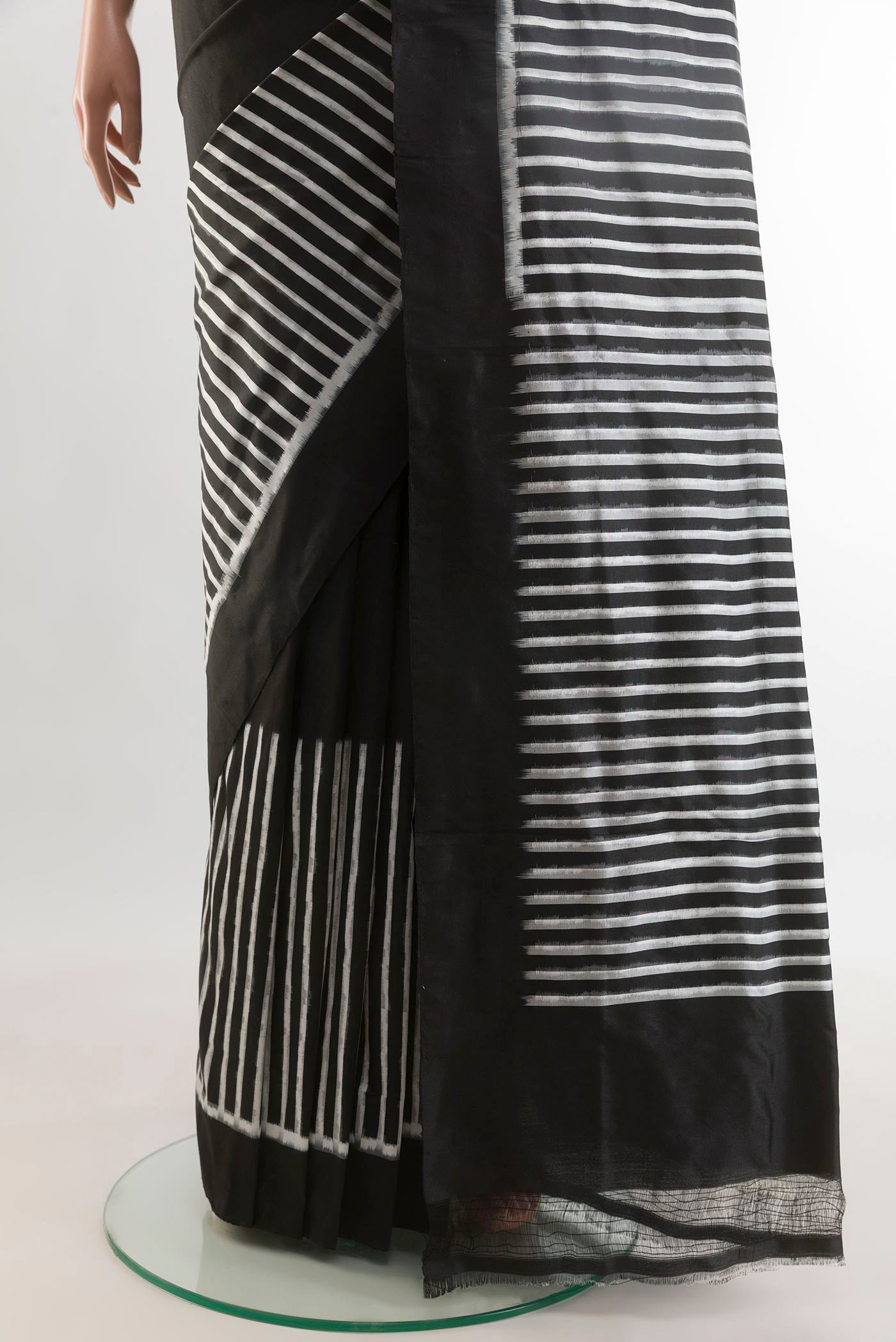 Pleats and pallu of Black Pochampally Silk Saree with Stripes on the body and Plain Border. 