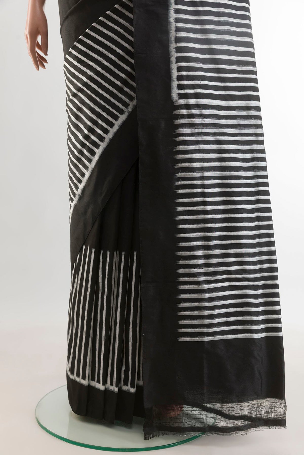 Pleats and pallu of Black Pochampally Silk Saree with Stripes on the body and Plain Border. 