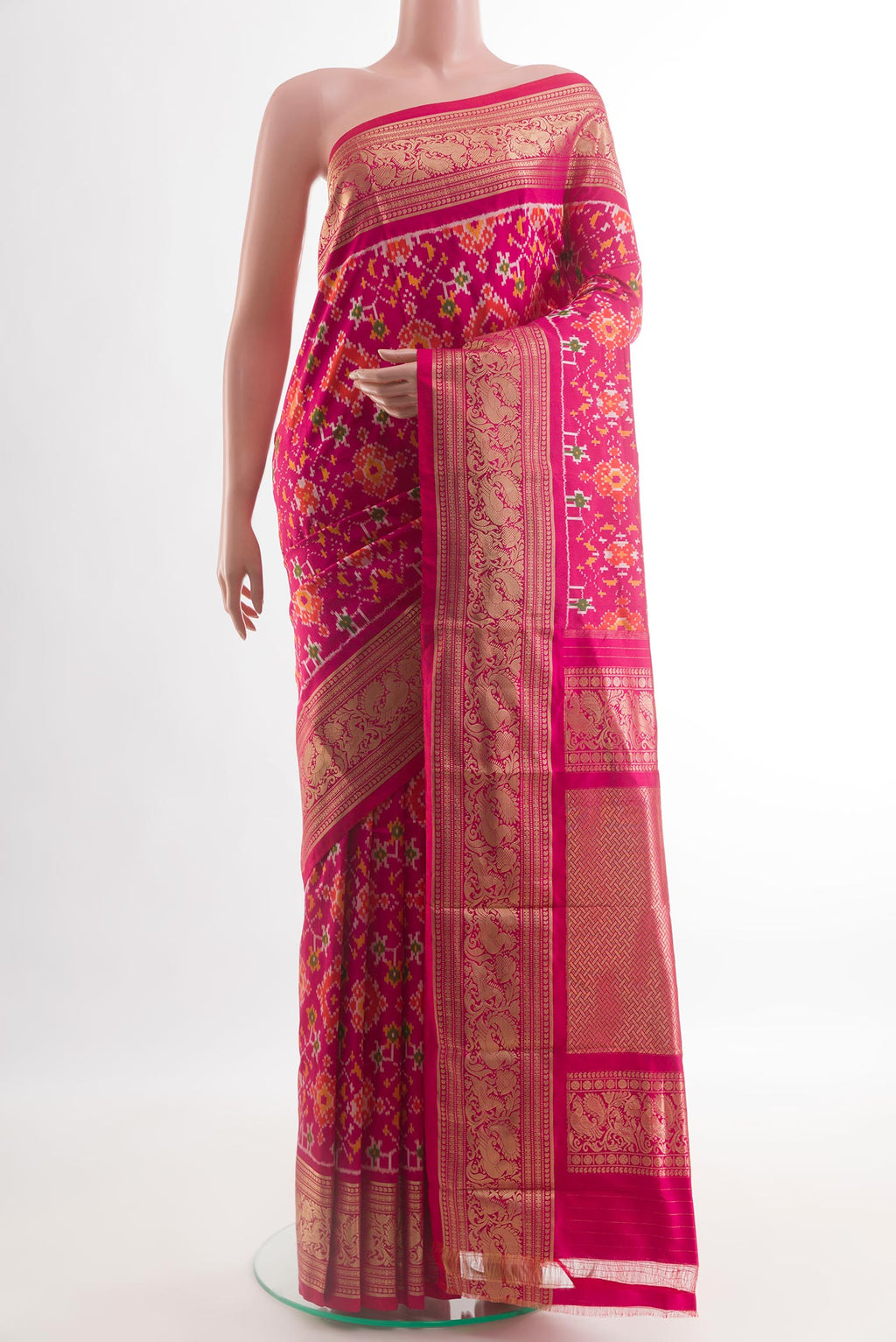Pink Pochampally Silk Saree with Ikat design on the body and Zari Border.  displayed on a mannequin