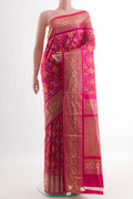 Pink Pochampally Silk Saree with Ikat design on the body and Zari Border.  displayed on a mannequin