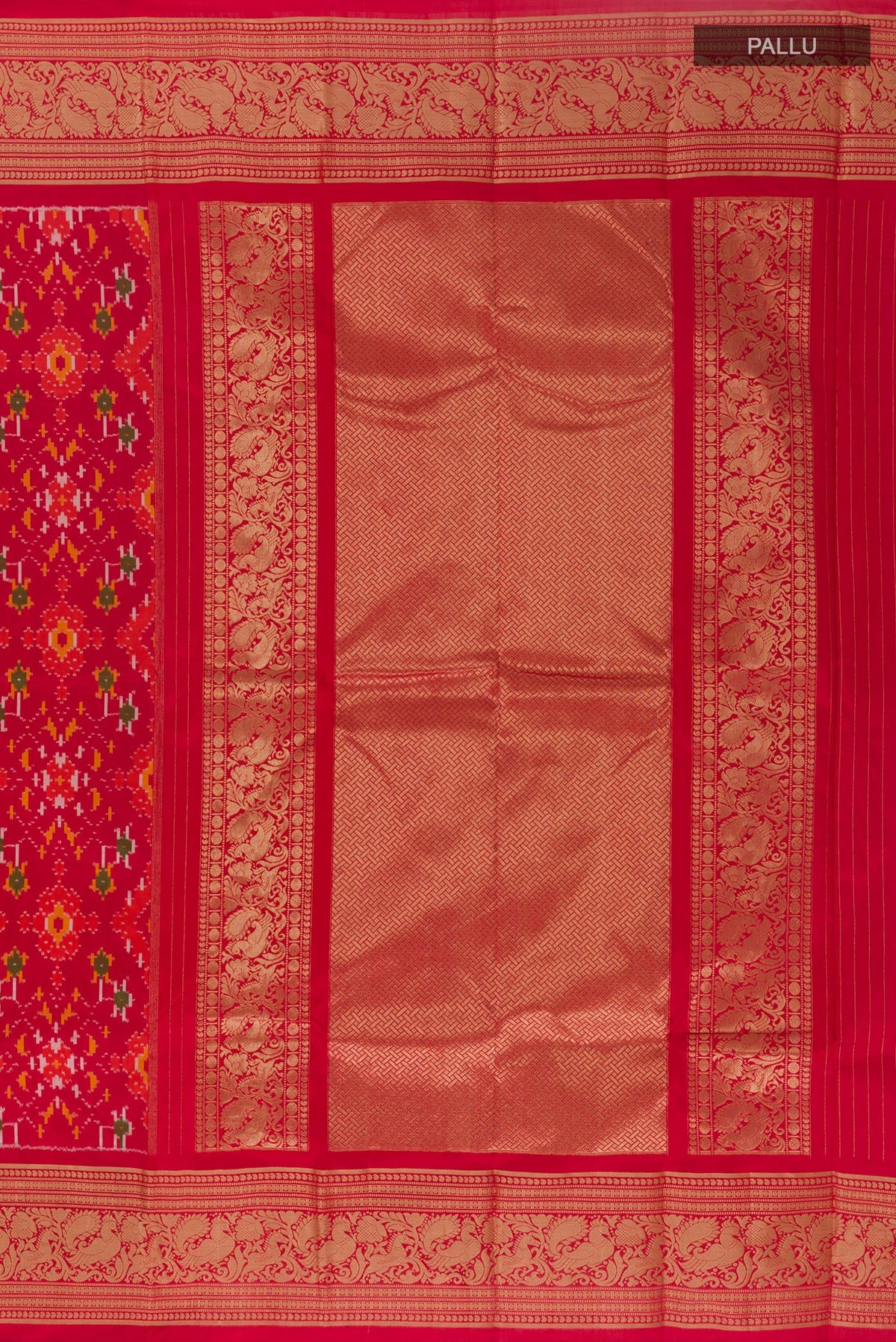 Close up image of the pallu of Red Pochampally Silk Saree with Pure Ikat on the body and Zari Border. 