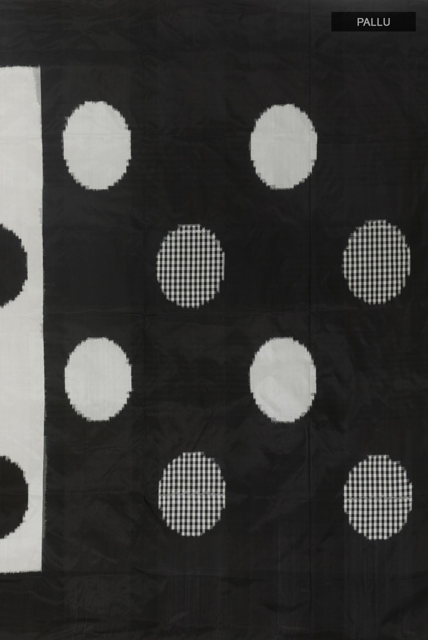 Close up image of the pallu of White Pochampally Silk Saree with Pure Ikat on the body and Plain Border. 