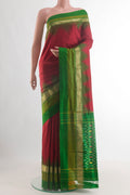 Maroon Pochampally Silk Saree with Plain Body and Zari Border.  displayed on a mannequin