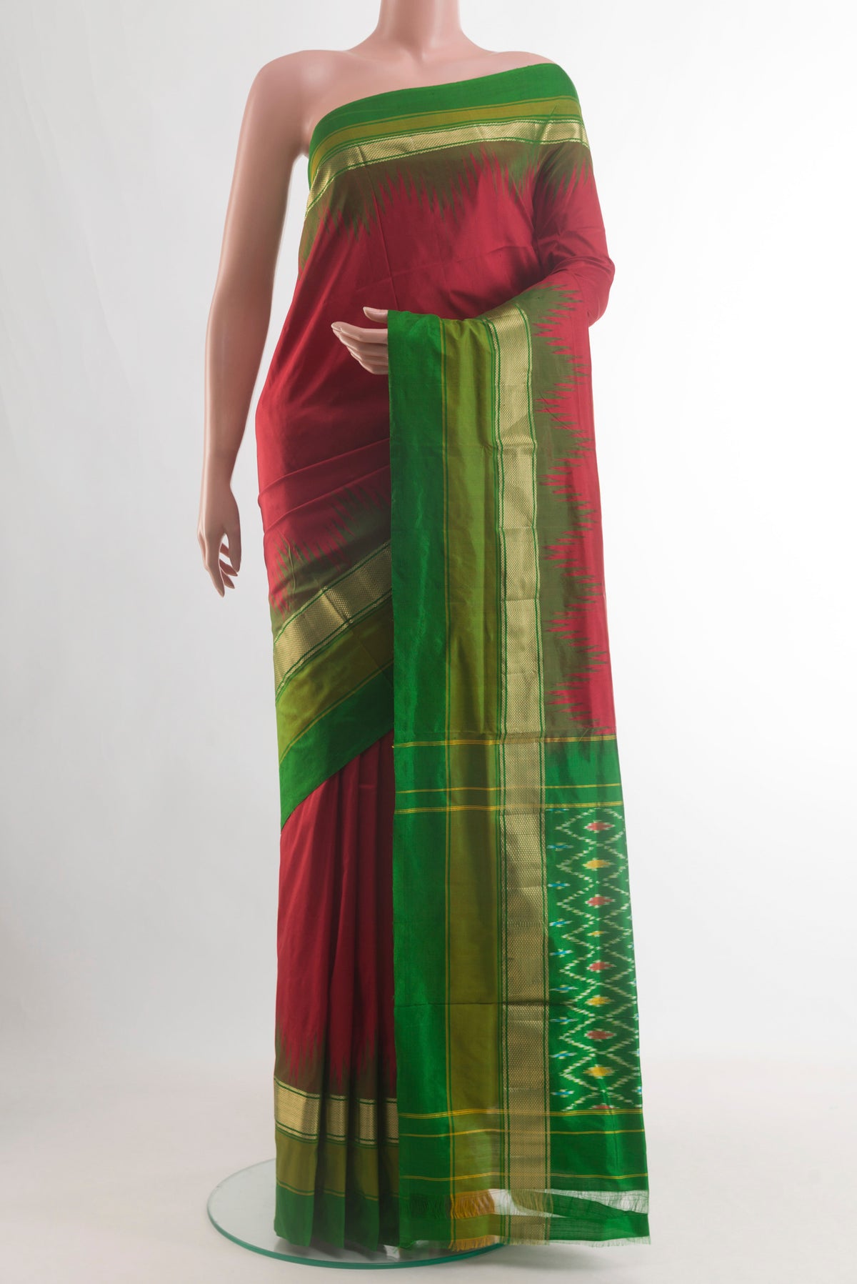 Maroon Pochampally Silk Saree with Plain Body and Zari Border.  displayed on a mannequin