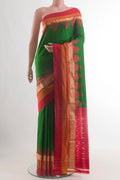 Green Pochampally Silk Saree with Plain Body and Zari Border.  displayed on a mannequin