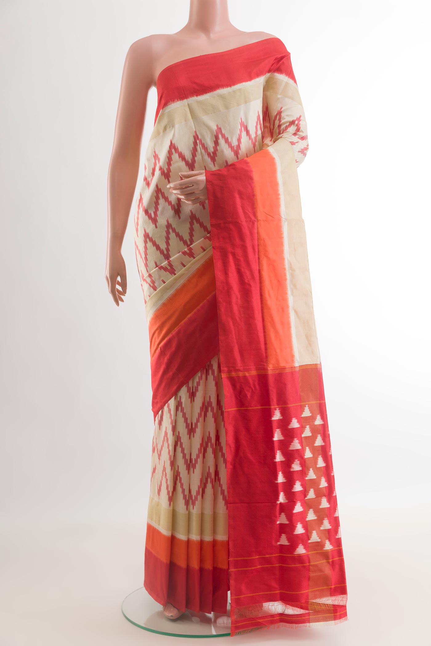 Cream Pochampally Silk Saree with Pure Ikat on the body and Plain Border.  displayed on a mannequin