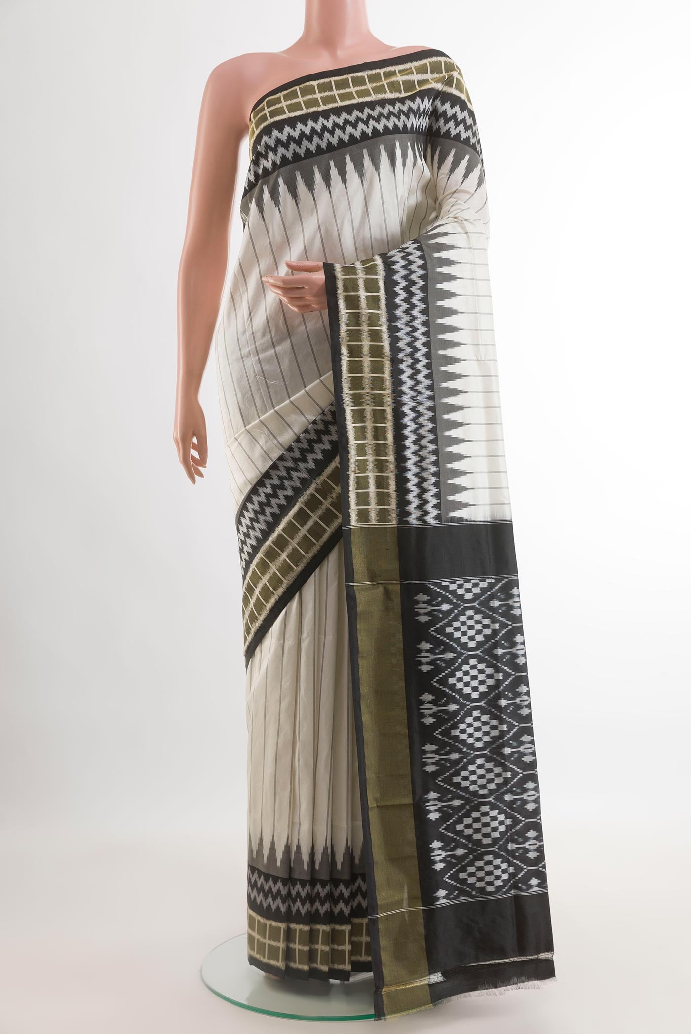 Off White Pochampally Silk Saree with Stripes on the body and Ikat Border.  displayed on a mannequin