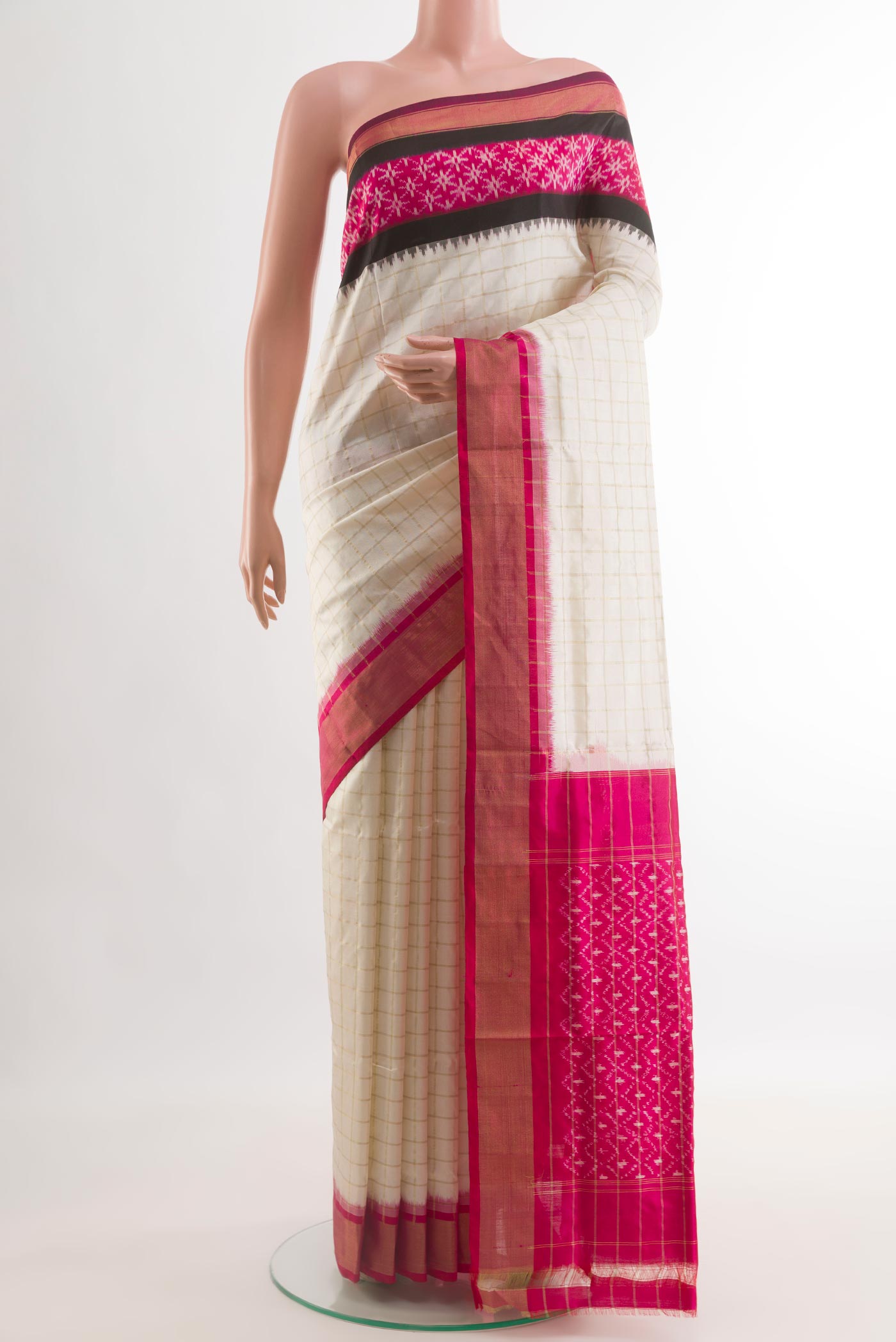 Off White Pochampally Silk Saree with Checked design on the body and Zari Border.  displayed on a mannequin