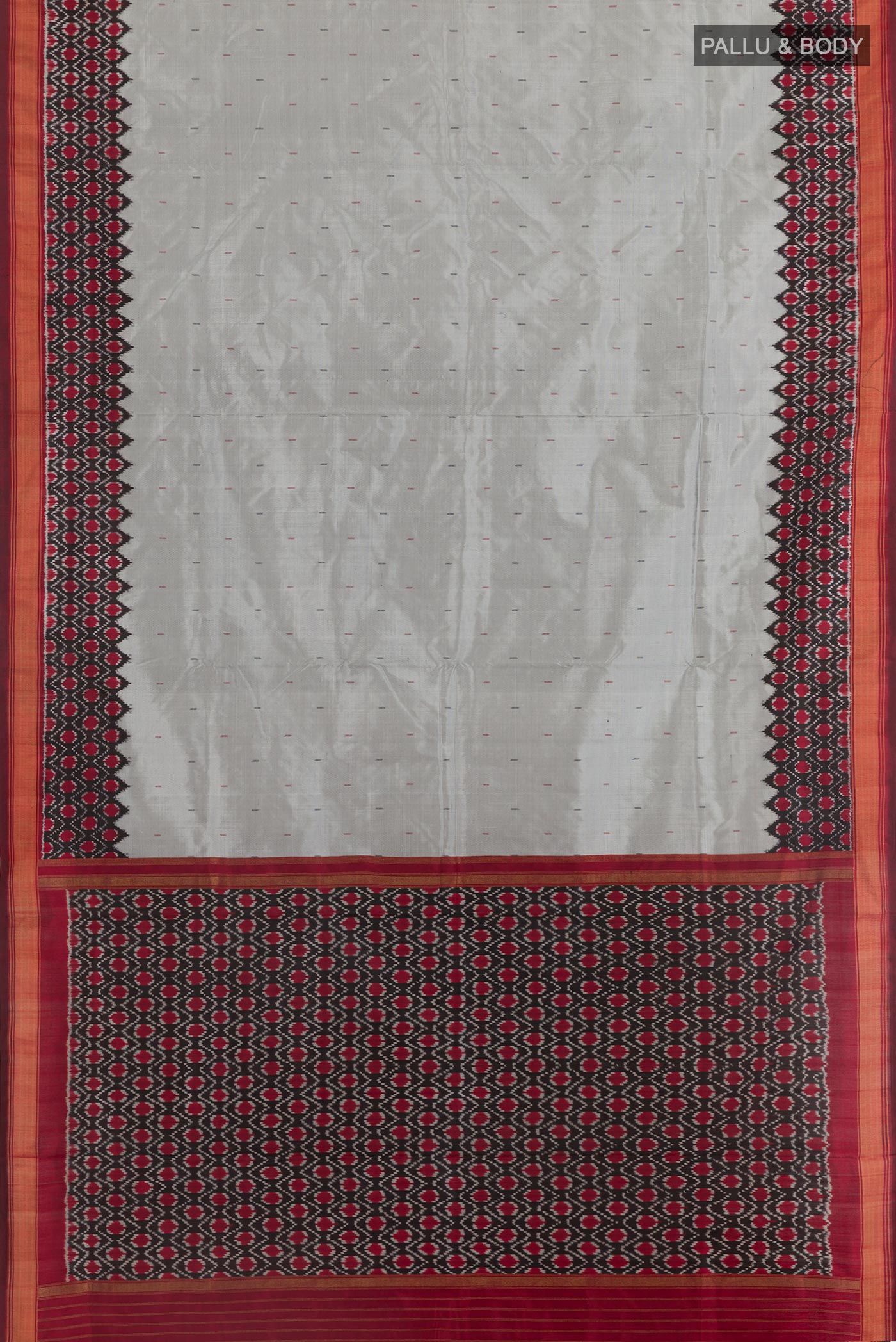 Flat view of Grey Pochampally Silk Saree with Plain Body and Ikat Border. 
