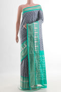 Grey Pochampally Silk Saree with Pure Ikat on the body and Zari Border.  displayed on a mannequin