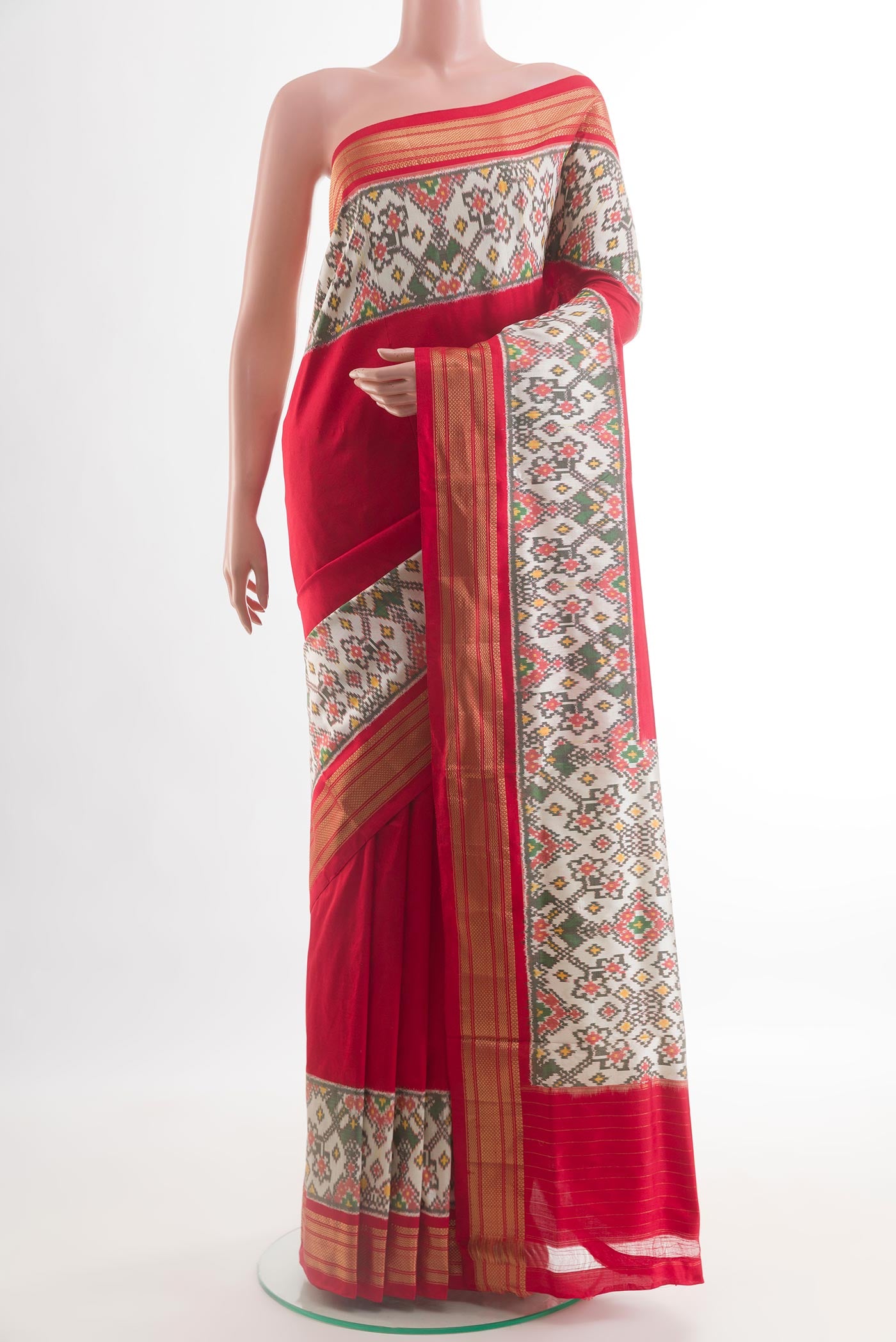 Red Pochampally Silk Saree with Plain Body and Ikat Border.  displayed on a mannequin