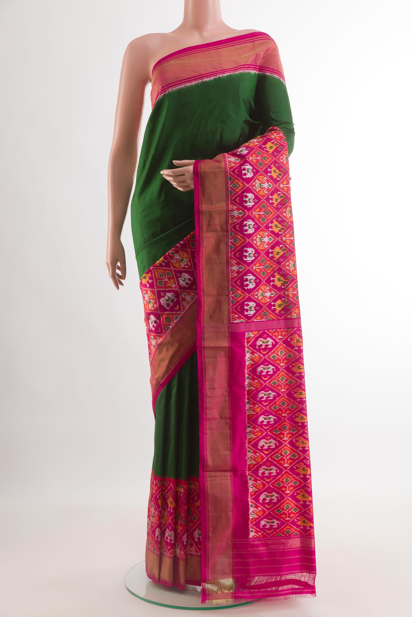 Green Pochampally Silk Saree with Plain Body and Ikat Border.  displayed on a mannequin