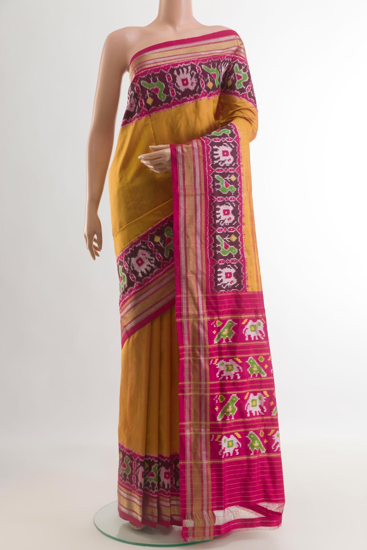 Mustard Pochampally Silk Saree with Plain Body and Zari Border.  displayed on a mannequin