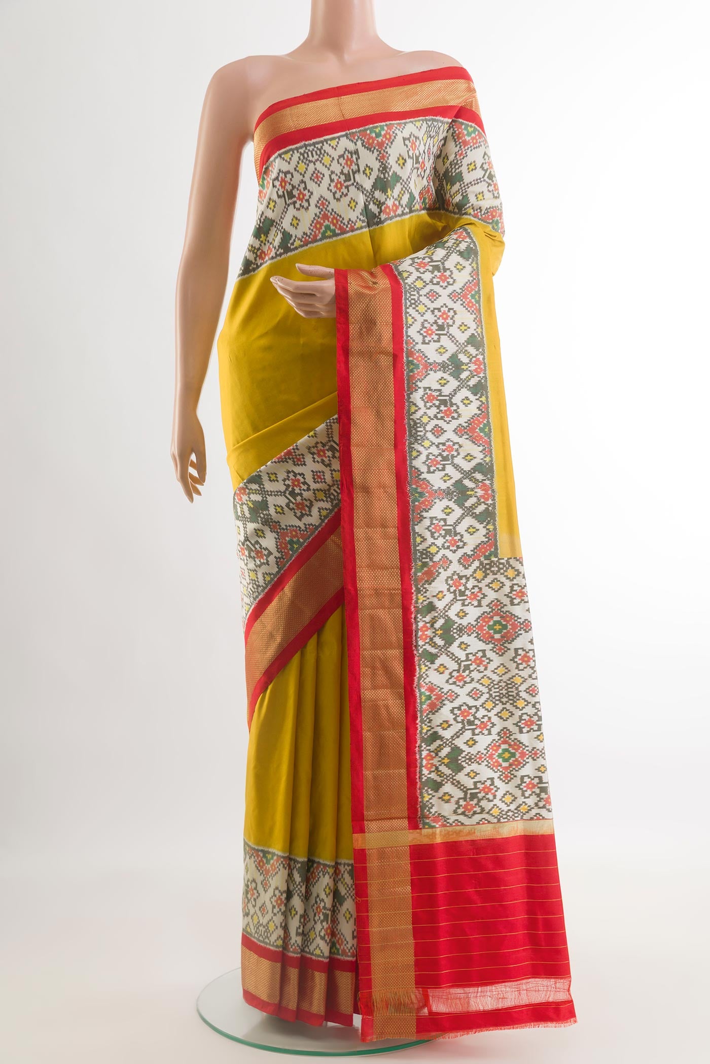 Yellow Pochampally Silk Saree with Plain Body and Ikat Border.  displayed on a mannequin