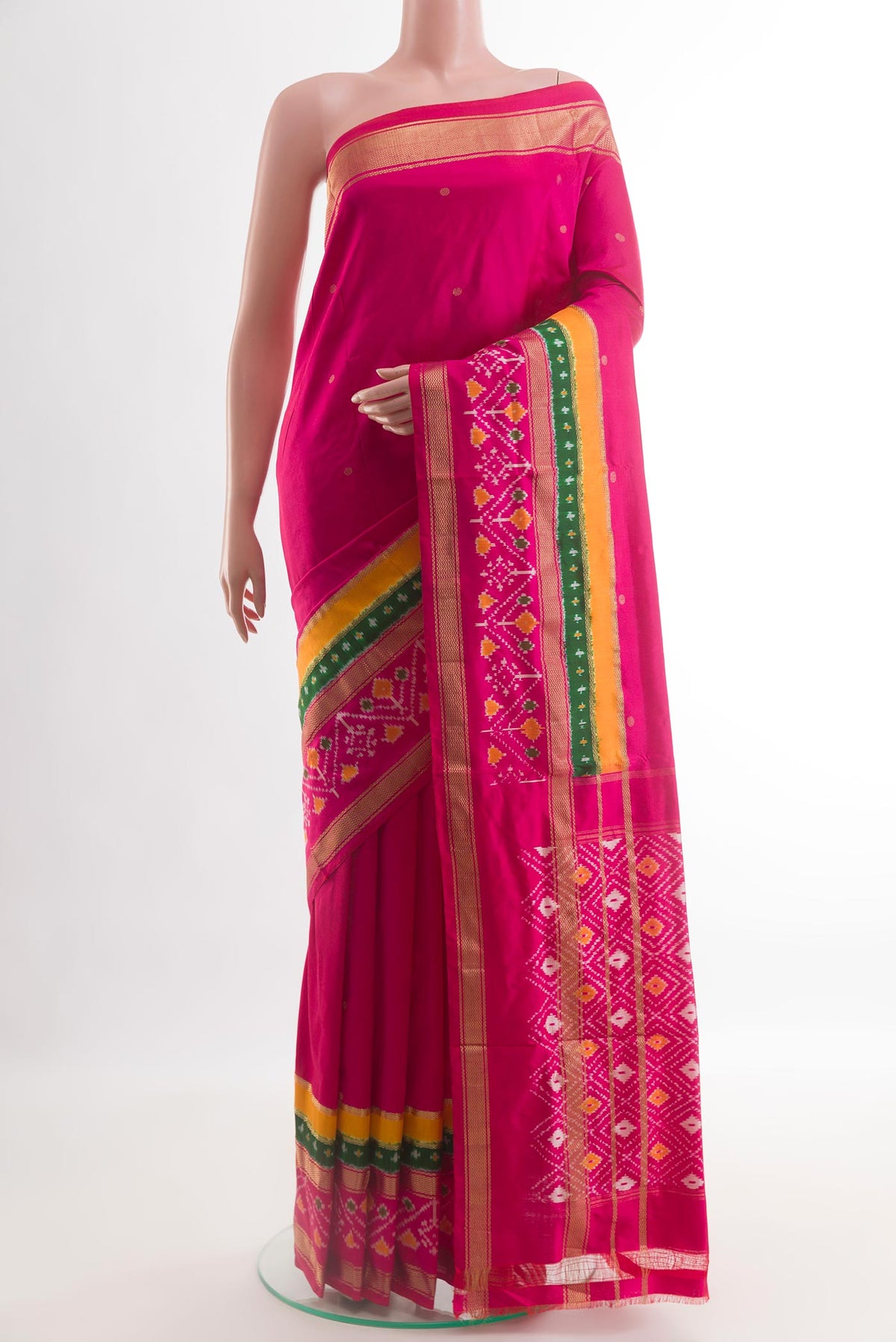 Rani Pink Pochampally Silk Saree with Pure Ikat on the body and Zari Border.  displayed on a mannequin