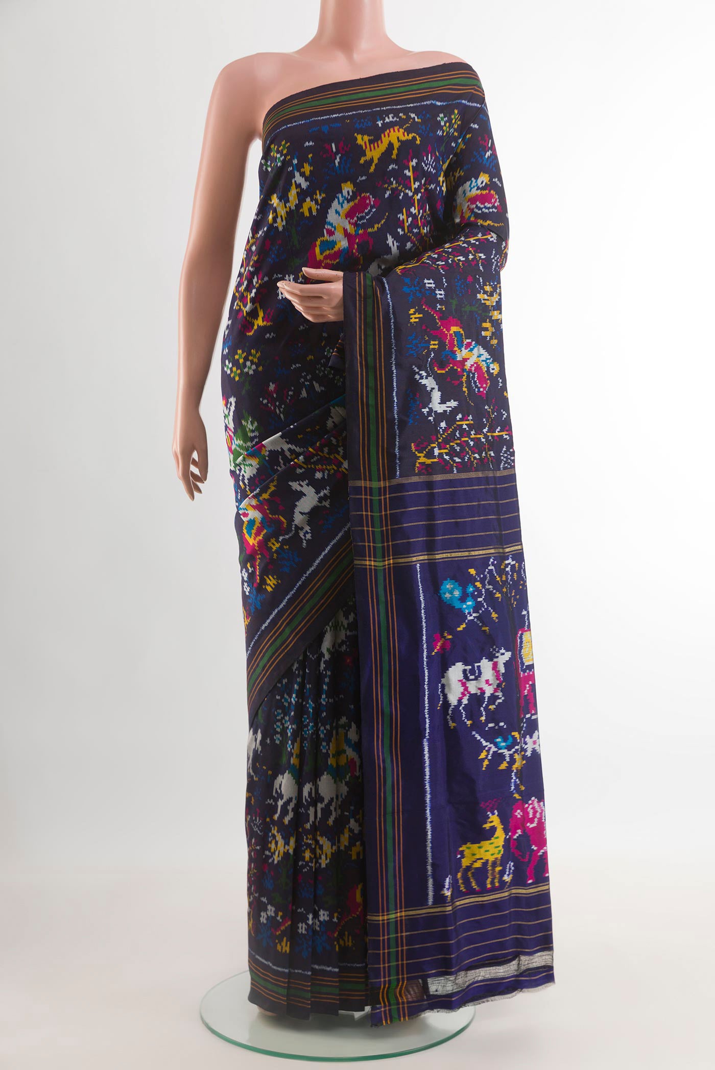 Navy Blue Pochampally Silk Saree with Pure Ikat on the body and Plain Border.  displayed on a mannequin