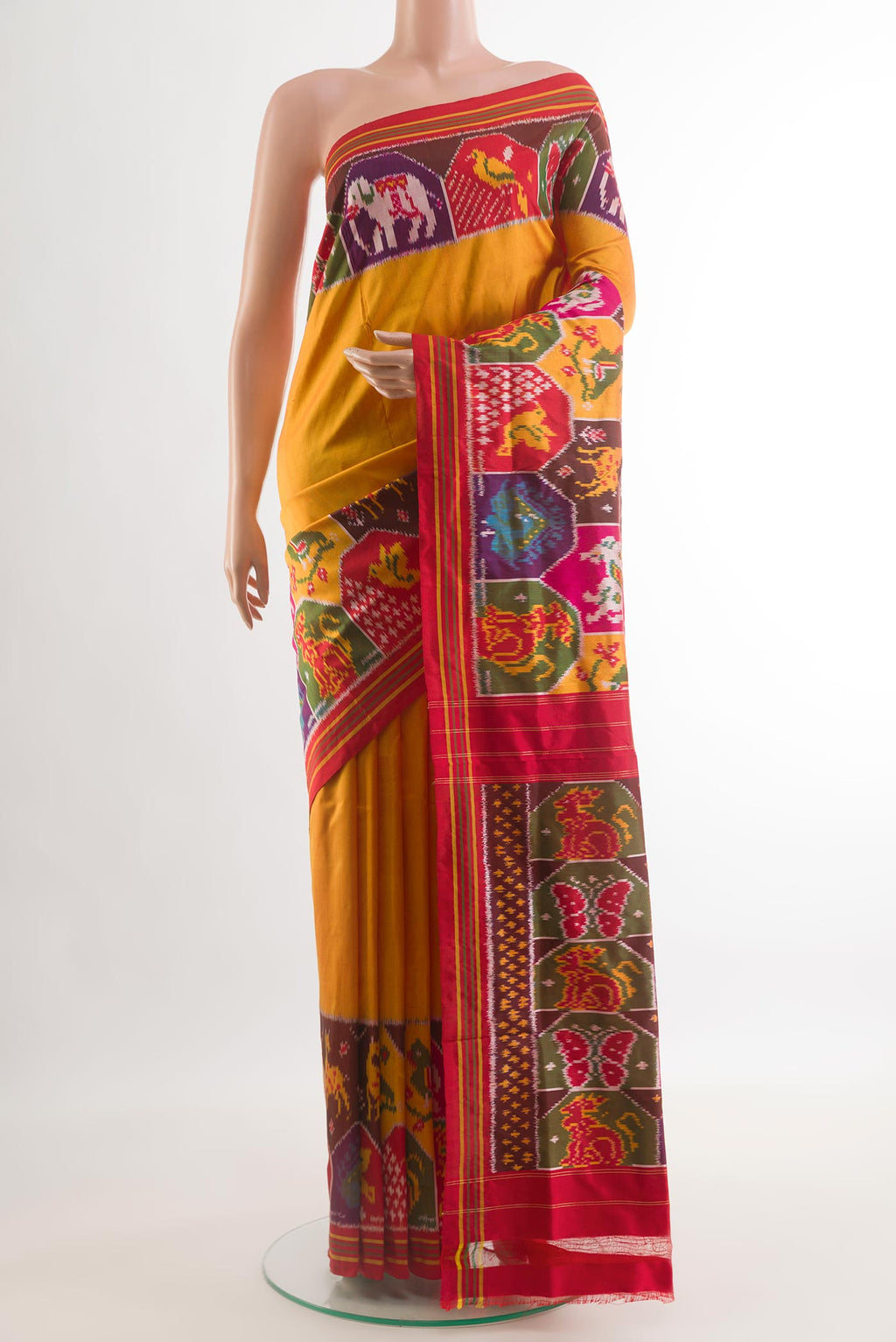 Mustard Pochampally Silk Saree with Plain Body and Zari Border.  displayed on a mannequin