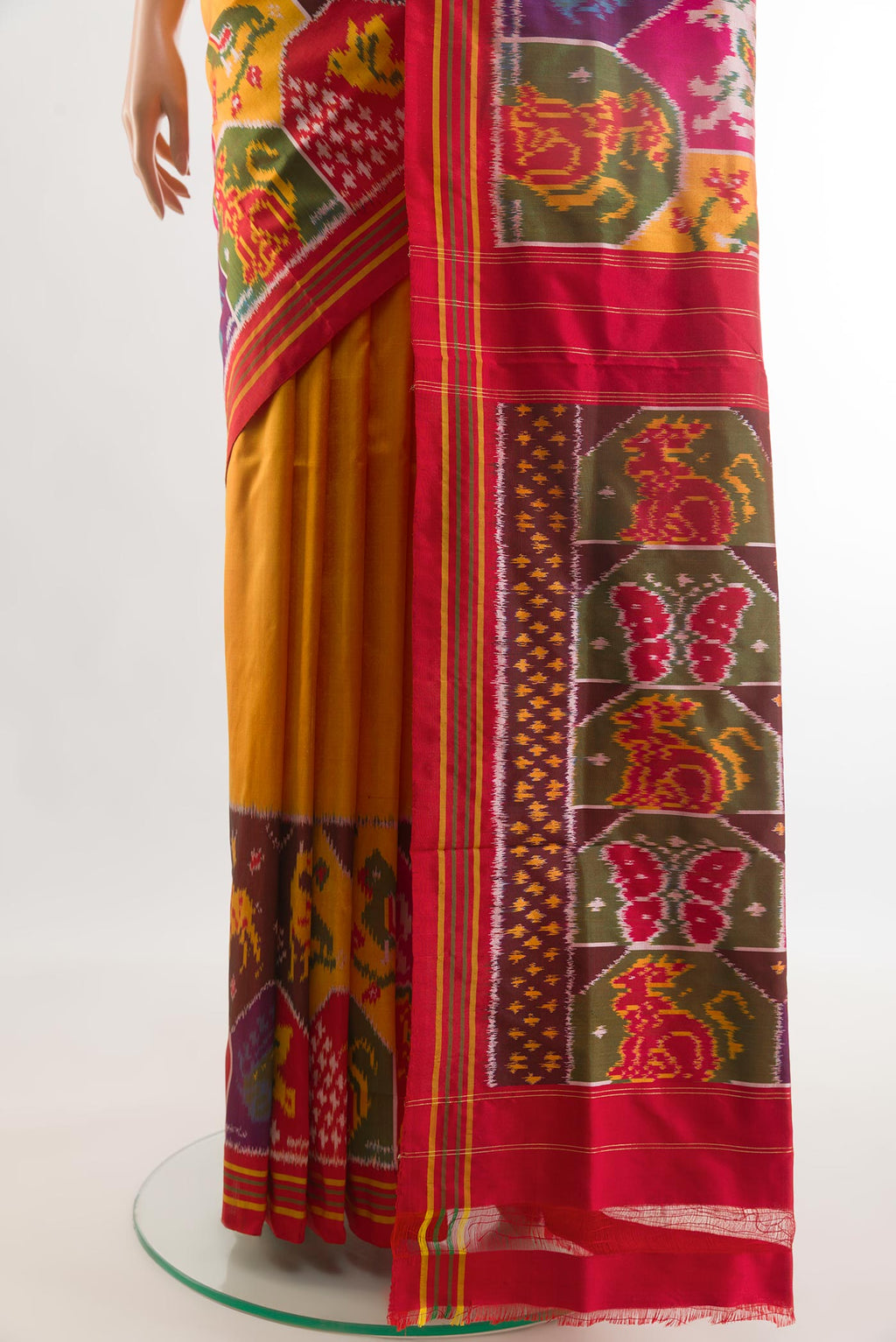 Pleats and pallu of Mustard Pochampally Silk Saree with Plain Body and Zari Border. 