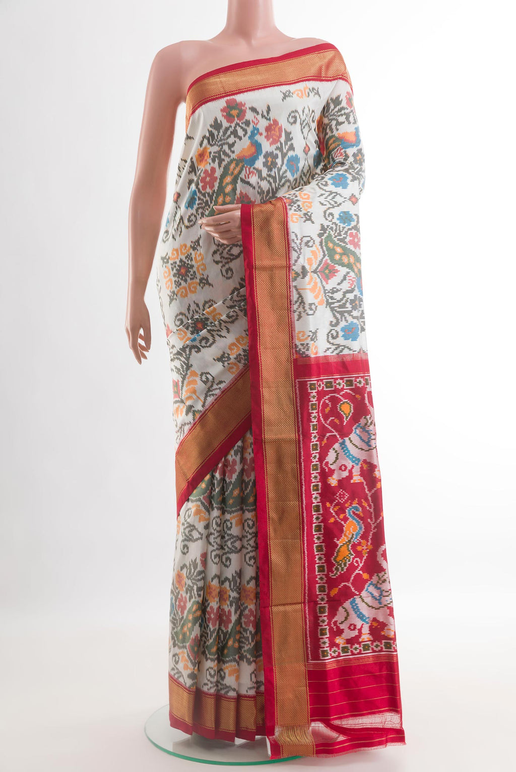 Off White Pochampally Silk Saree with Pure Ikat on the body and Zari Border.  displayed on a mannequin