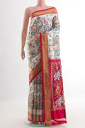Off White Pochampally Silk Saree with Pure Ikat on the body and Zari Border.  displayed on a mannequin