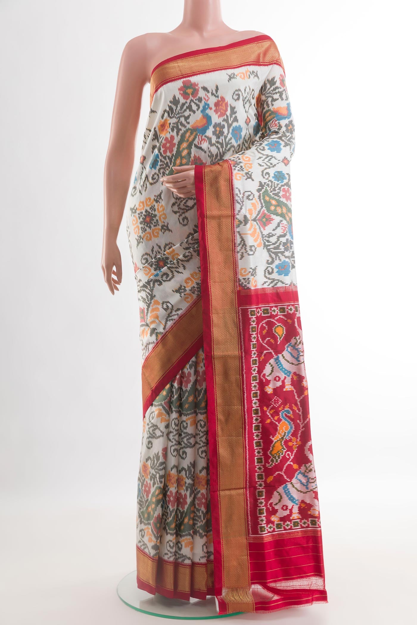 Off White Pochampally Silk Saree with Pure Ikat on the body and Zari Border.  displayed on a mannequin
