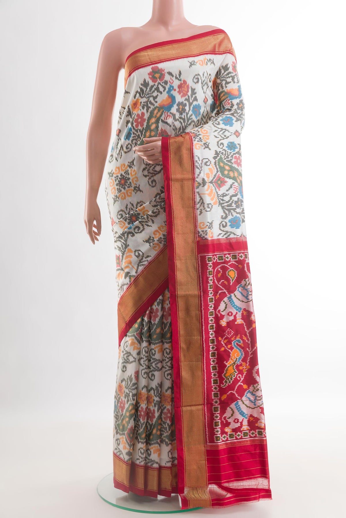 Off White Pochampally Silk Saree with Pure Ikat on the body and Zari Border.  displayed on a mannequin