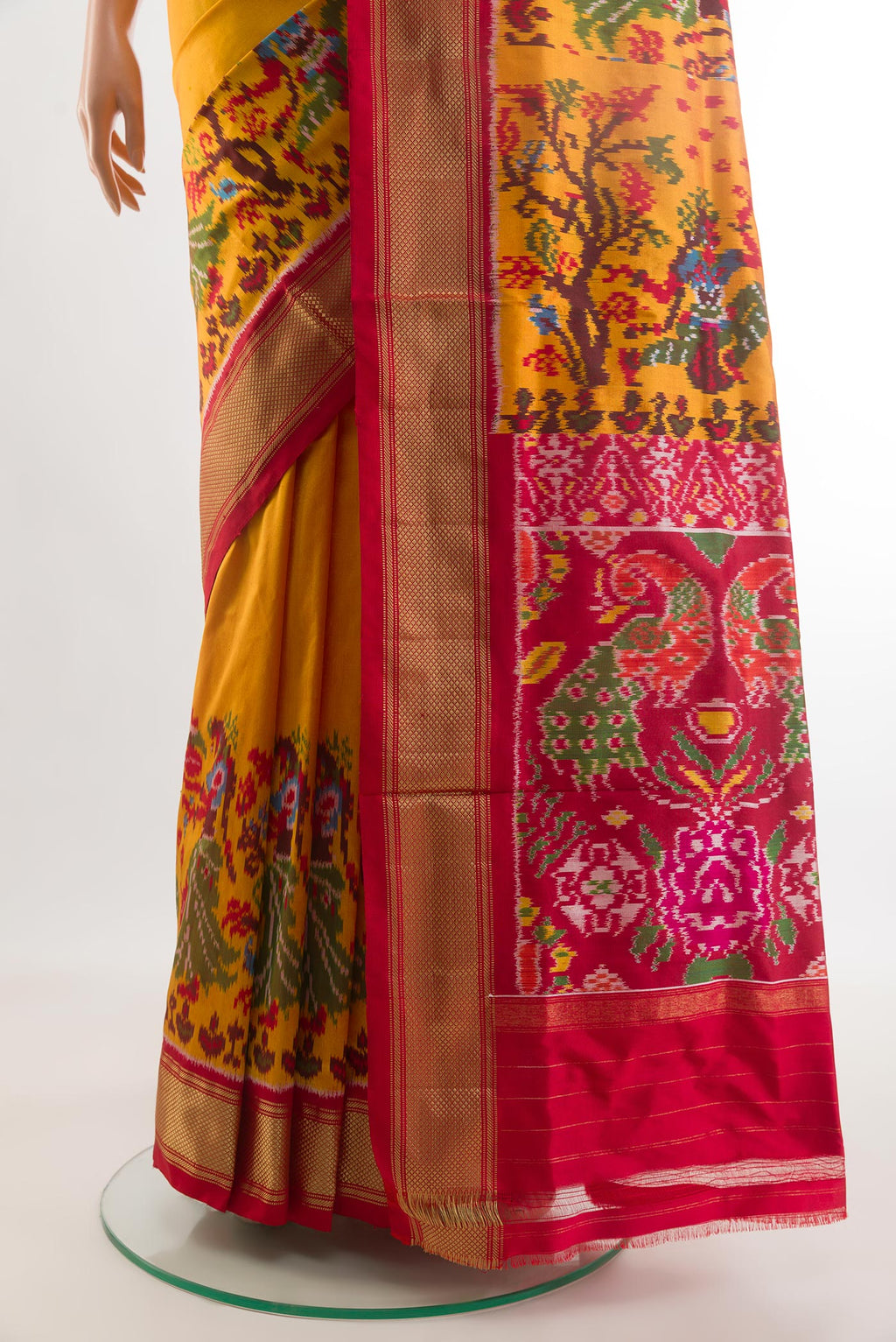 Pleats and pallu of Mustard Pochampally Silk Saree with Plain Body and Ikat Border. 