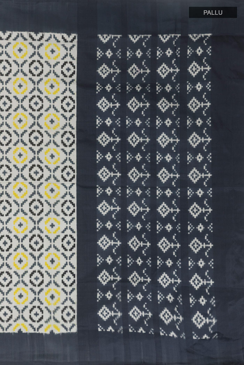 Close up image of the pallu of White Pochampally Silk Saree with Pure Ikat on the body and Plain Border. 