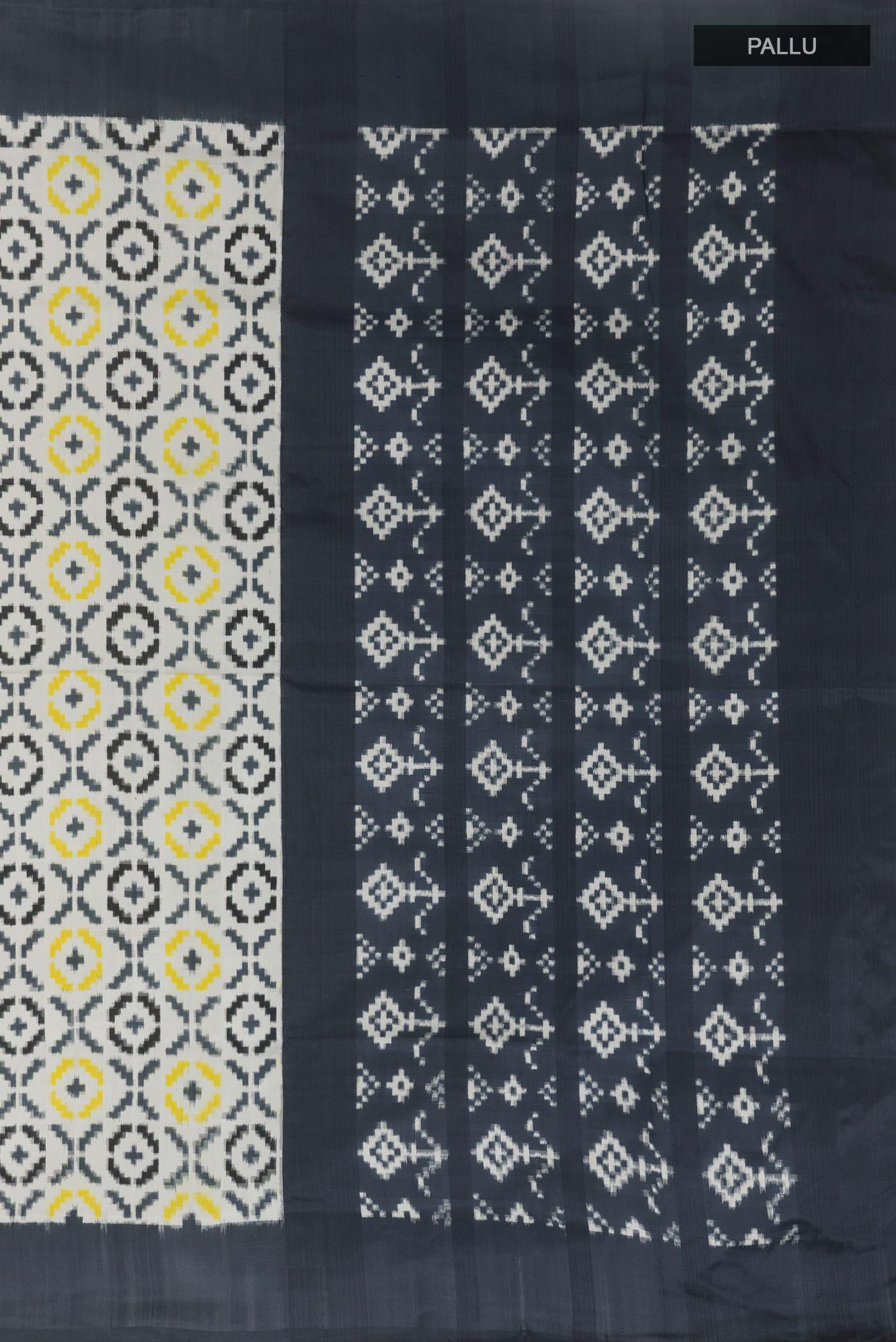 Close up image of the pallu of White Pochampally Silk Saree with Pure Ikat on the body and Plain Border. 
