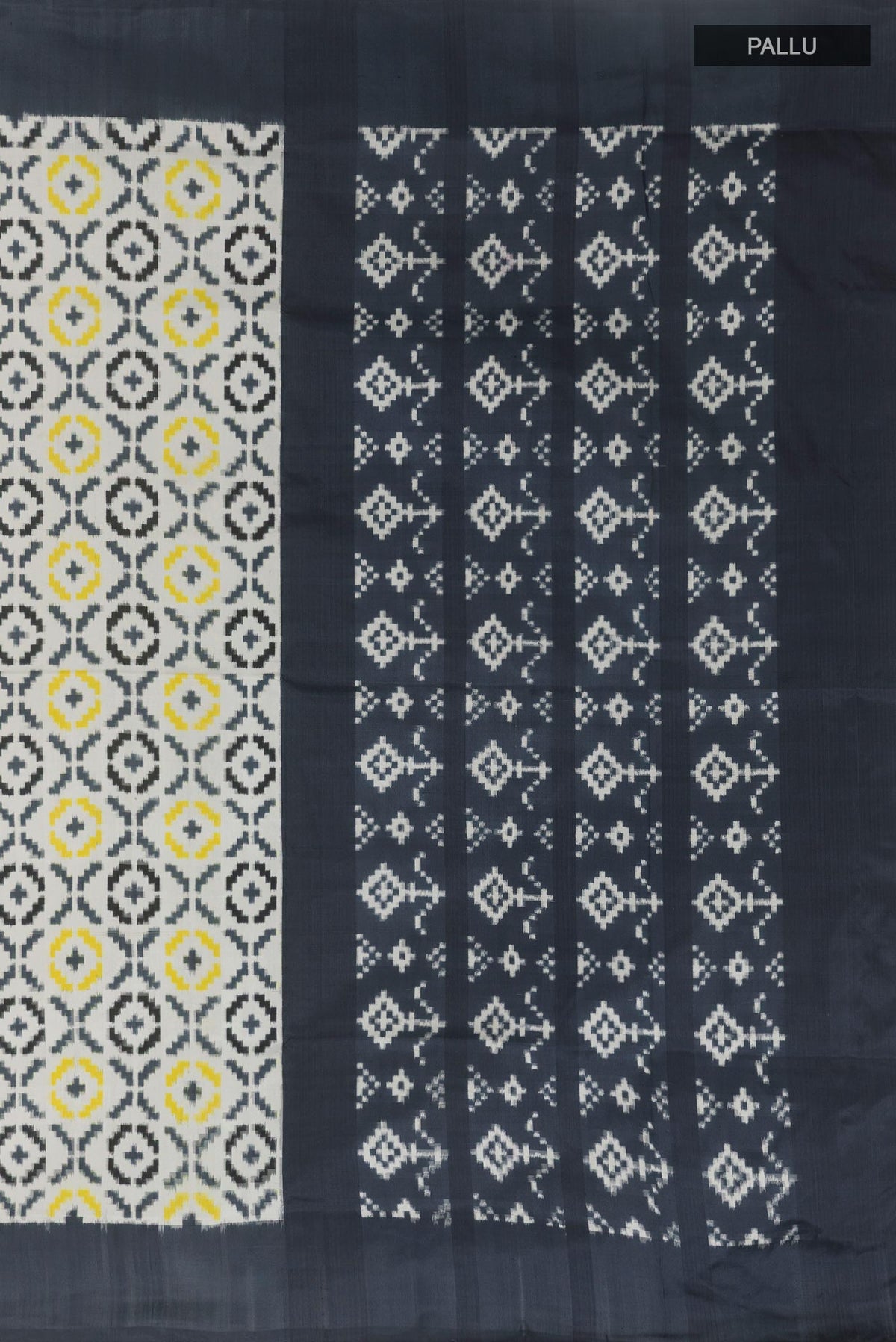 Close up image of the pallu of White Pochampally Silk Saree with Pure Ikat on the body and Plain Border. 