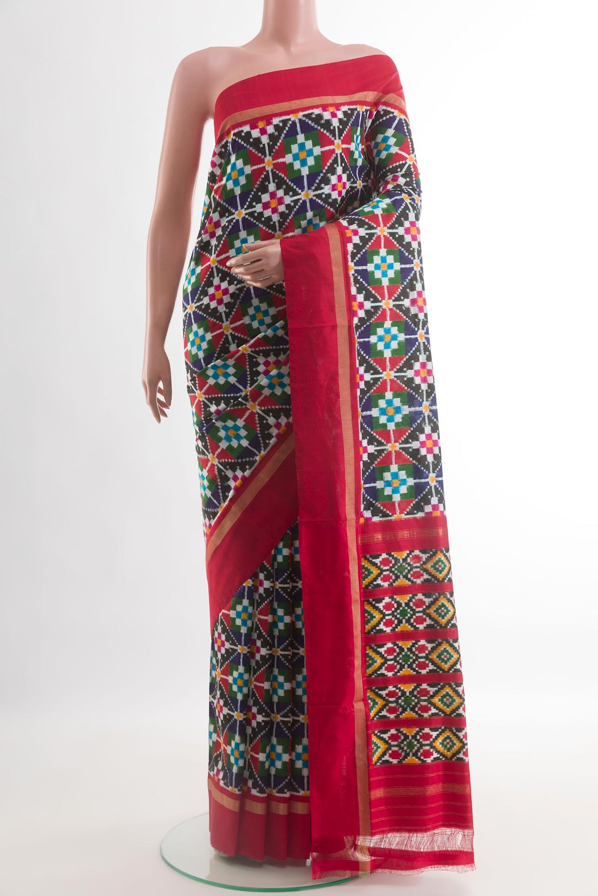 Multi Color Pochampally Silk Saree with Pure Ikat on the body and Zari Border.  displayed on a mannequin