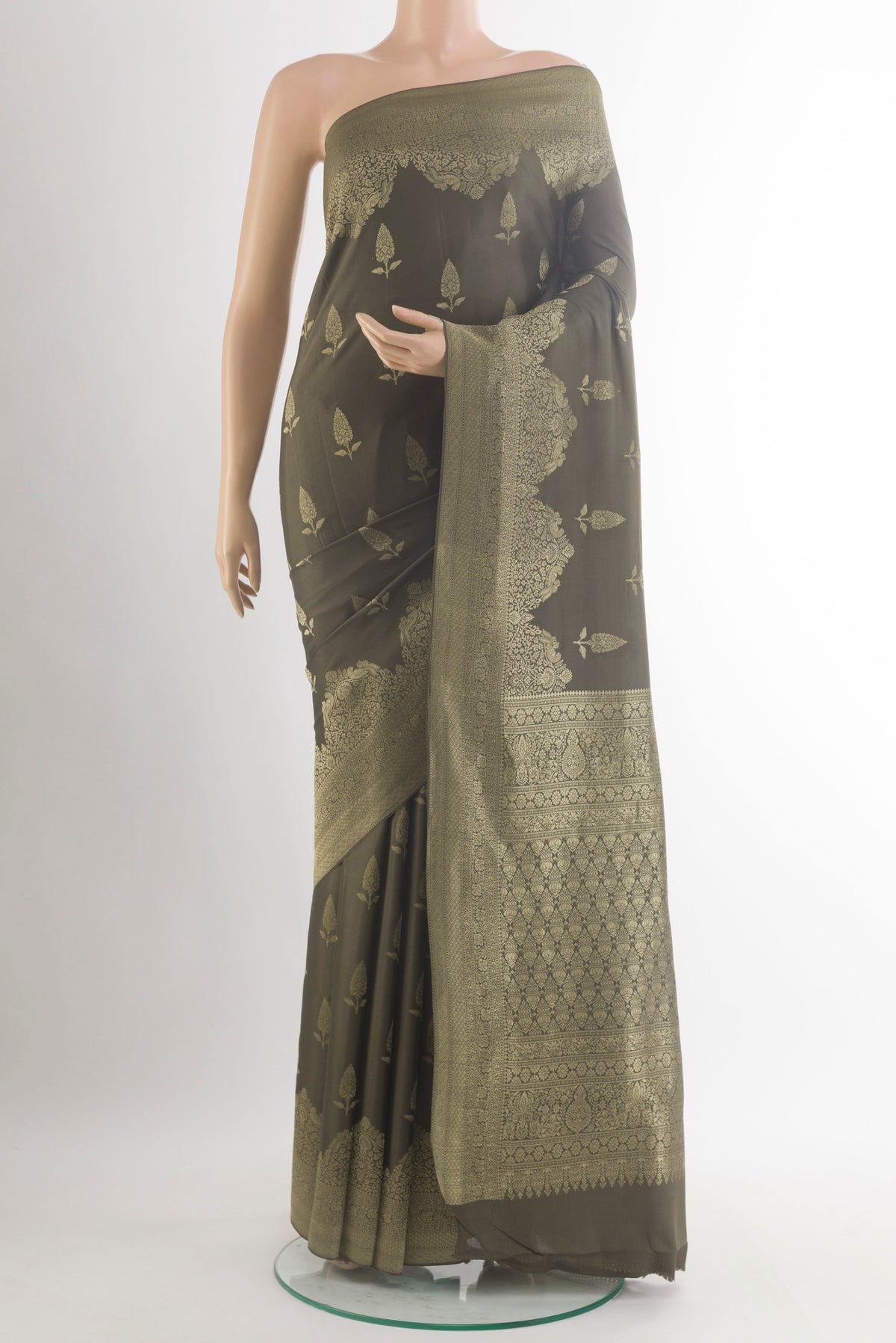 Mehandi Green Mysore Crepe Saree with Zari Butta on the body and Zari Border.  displayed on a mannequin