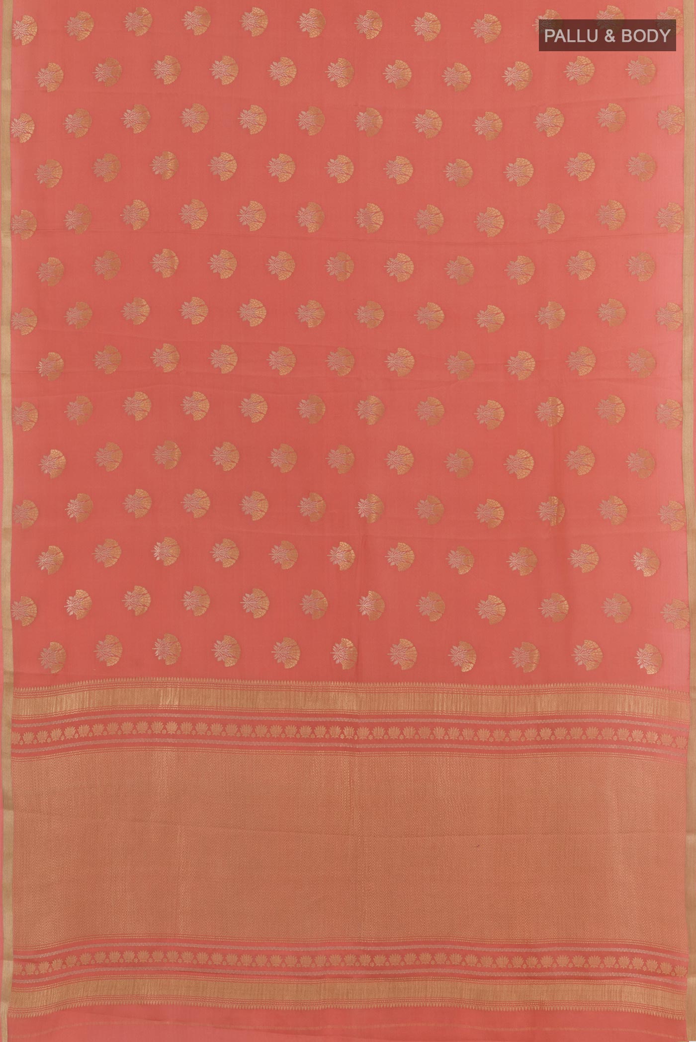 Flat view of Peach Mysore Crepe Saree with Zari Butta on the body and Zari Border. 