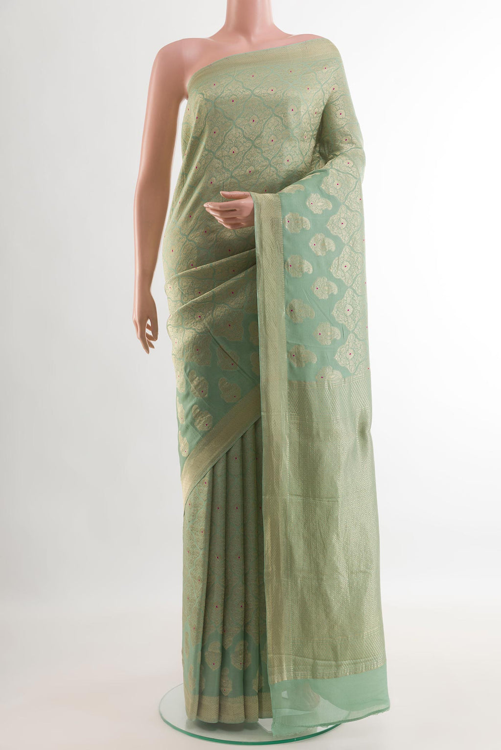 Green Mysore Crepe Saree with Zari Brocade on the body and Zari Border.  displayed on a mannequin