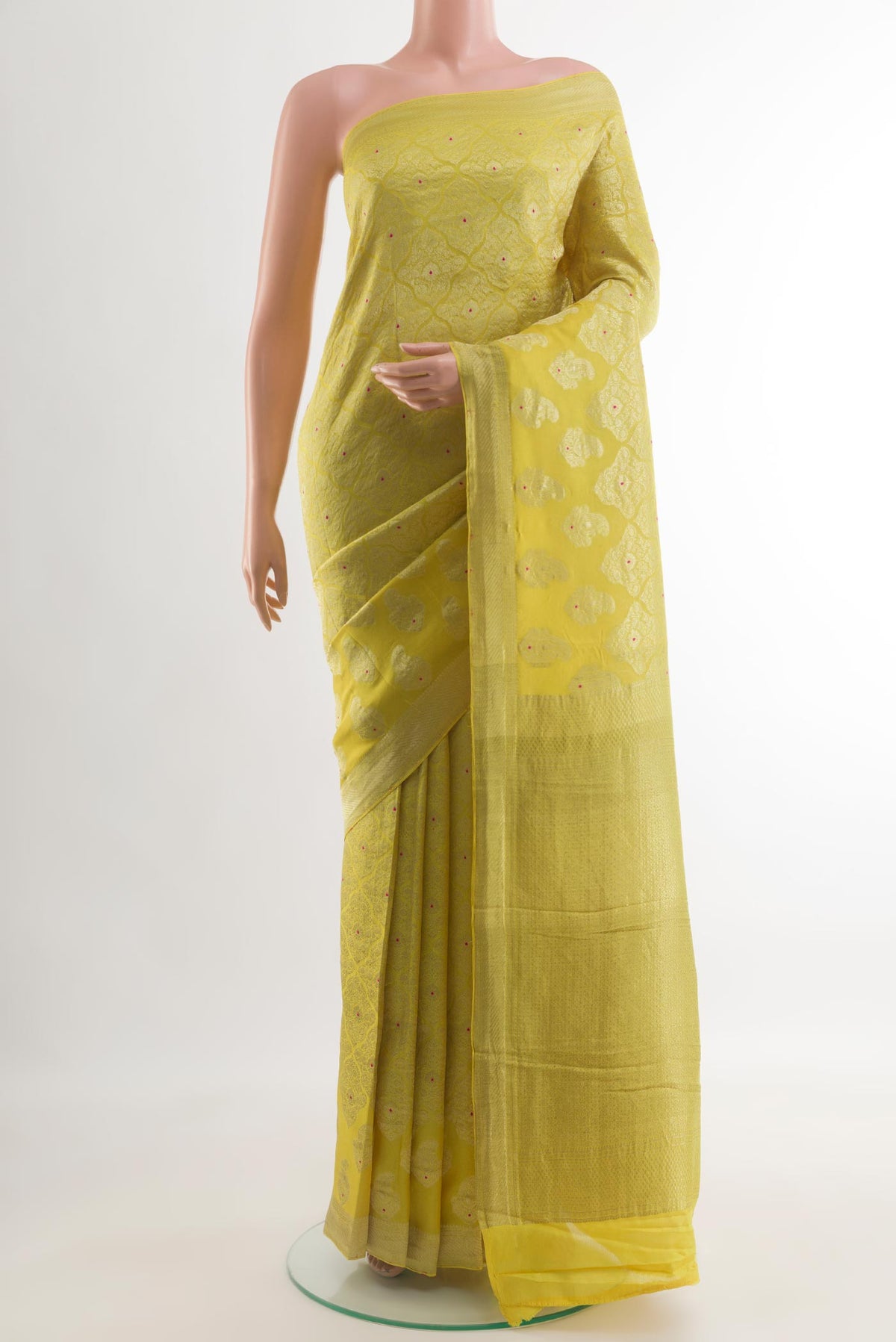 Yellow Mysore Crepe Saree with Zari Brocade on the body and Zari Border.  displayed on a mannequin