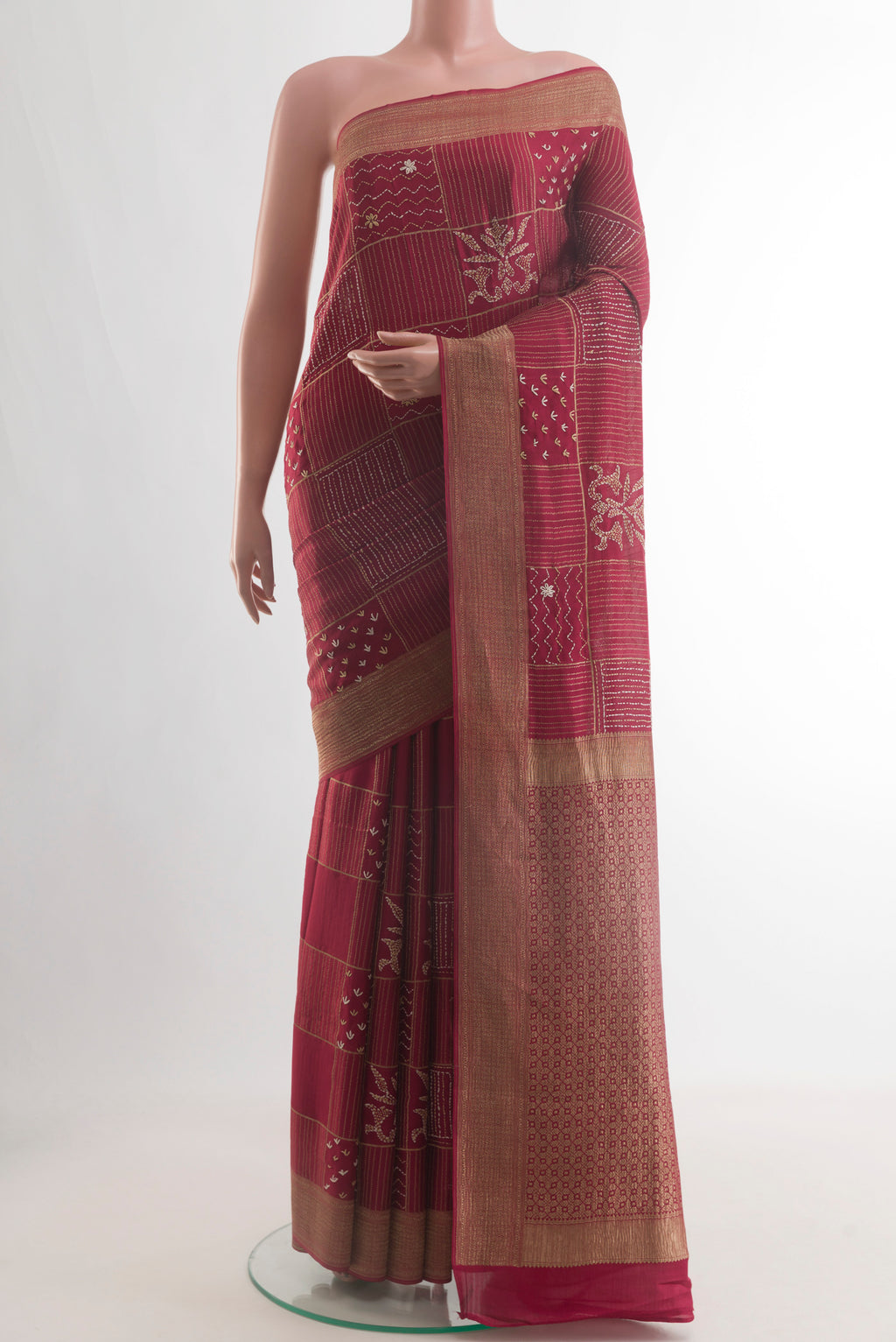 Maroon Mysore Crepe Saree with Embroidery on the body and Zari Border.  displayed on a mannequin