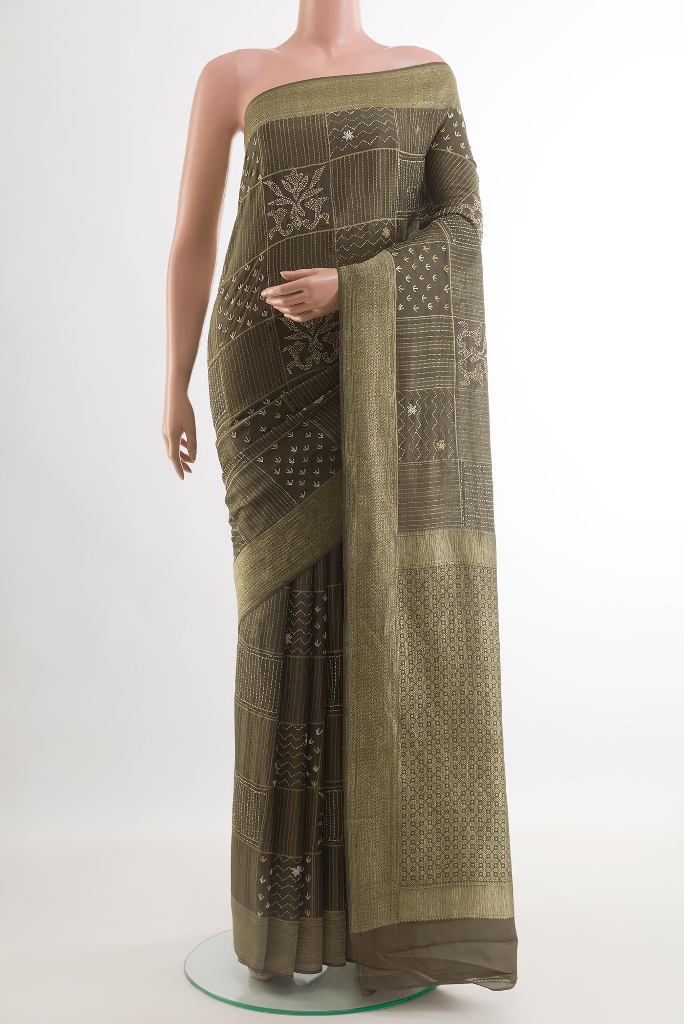 Mehandi Green Mysore Crepe Saree with Embroidery on the body and Zari Border.  displayed on a mannequin