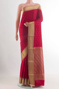 Red Mysore Crepe Saree with Zari Butta on the body and Zari Border.  displayed on a mannequin