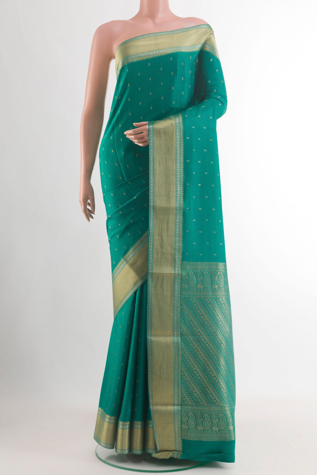 Sea Green Mysore Crepe Saree with Zari Butta on the body and Zari Border.  displayed on a mannequin