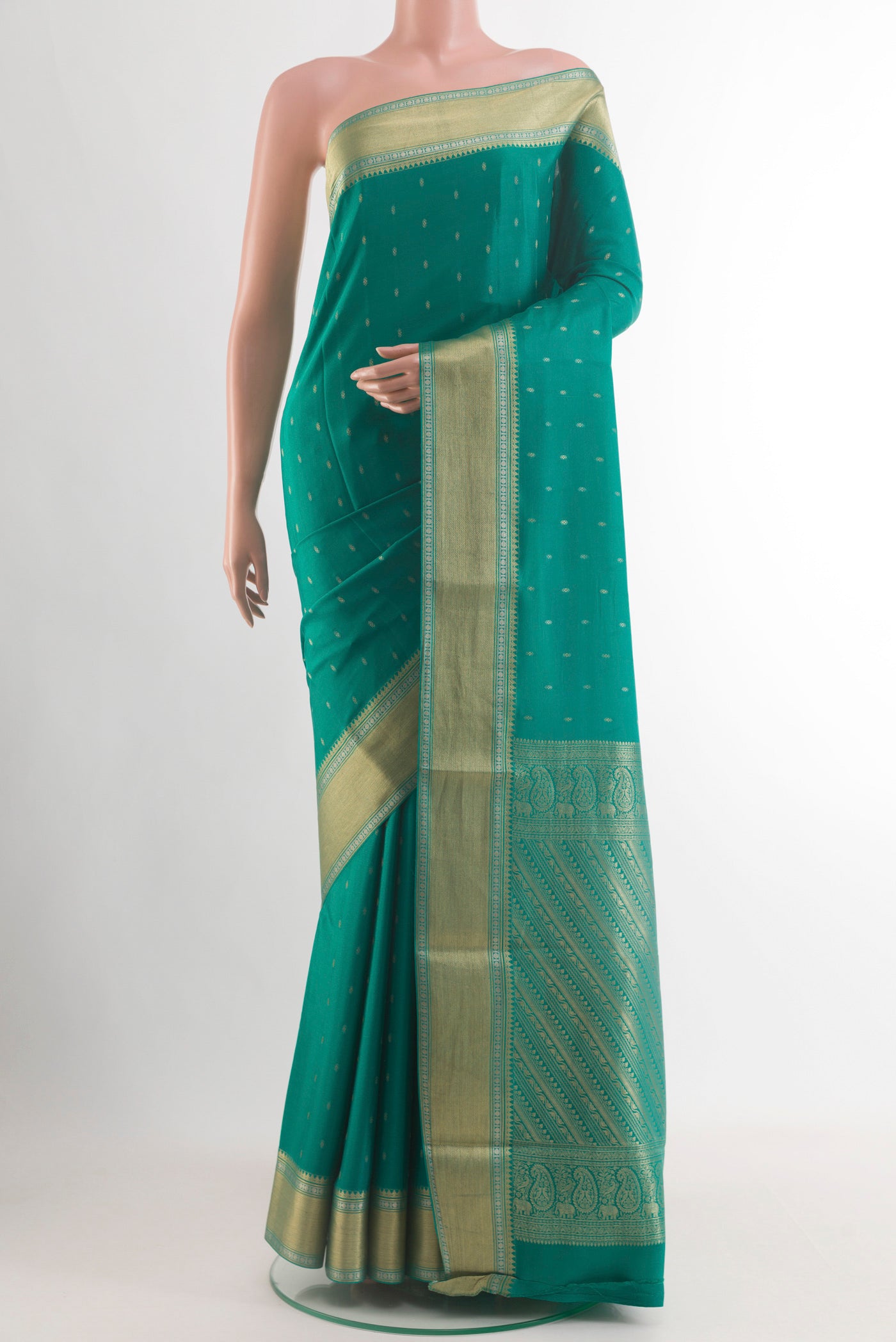 Sea Green Mysore Crepe Saree with Zari Butta on the body and Zari Border.  displayed on a mannequin